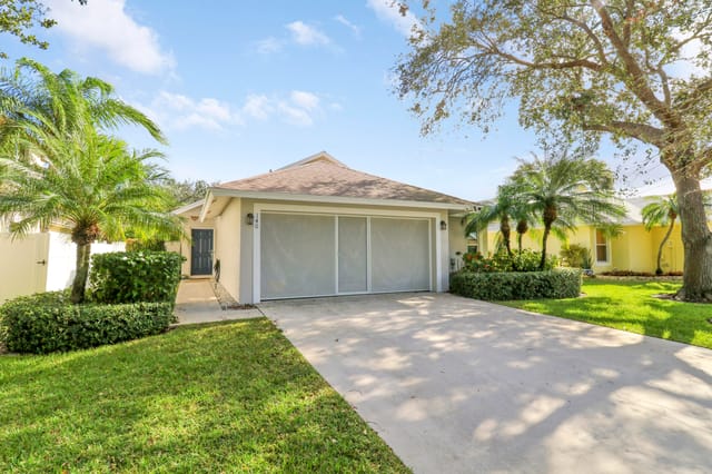 Exterior Front with Garage Screen