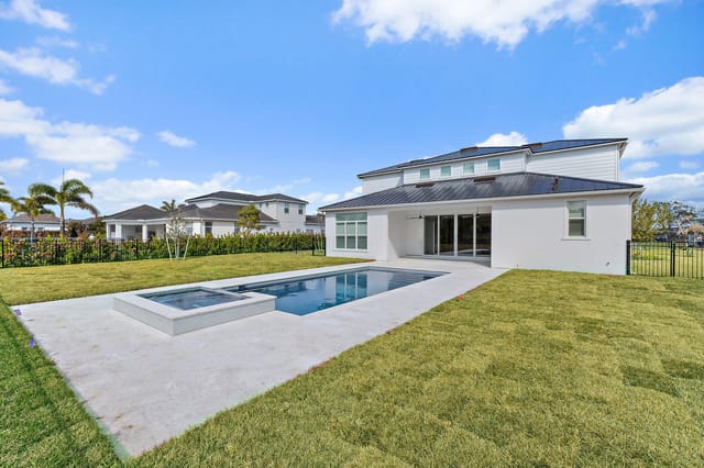 Back exterior with pool