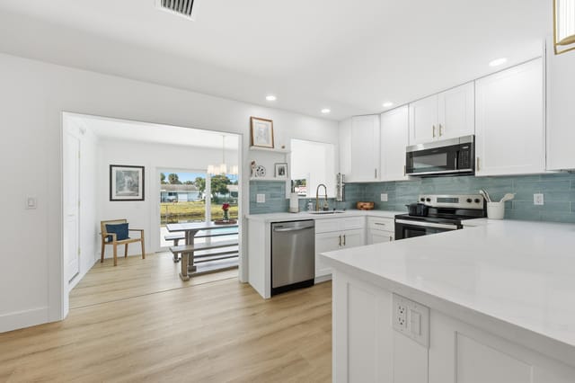 Kitchen w/ Dining Area View of Backyard