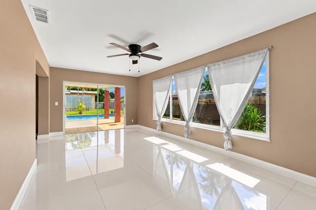 Bright Empty Living Space with Pool View